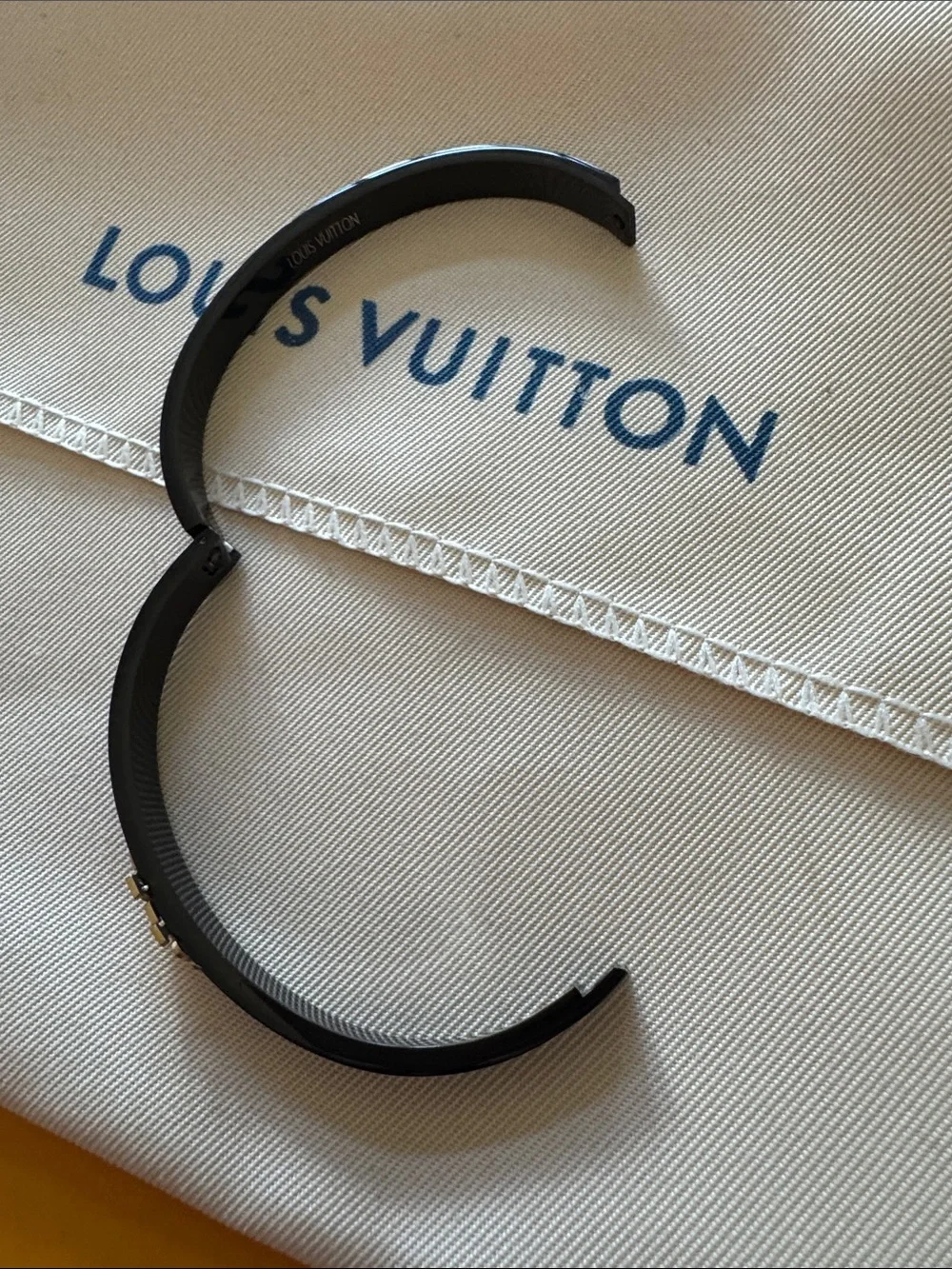 Louis Vuitton Black Bangle with Gold LV Motif